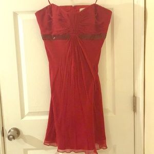 Silk strapless dress with red sequined waistline